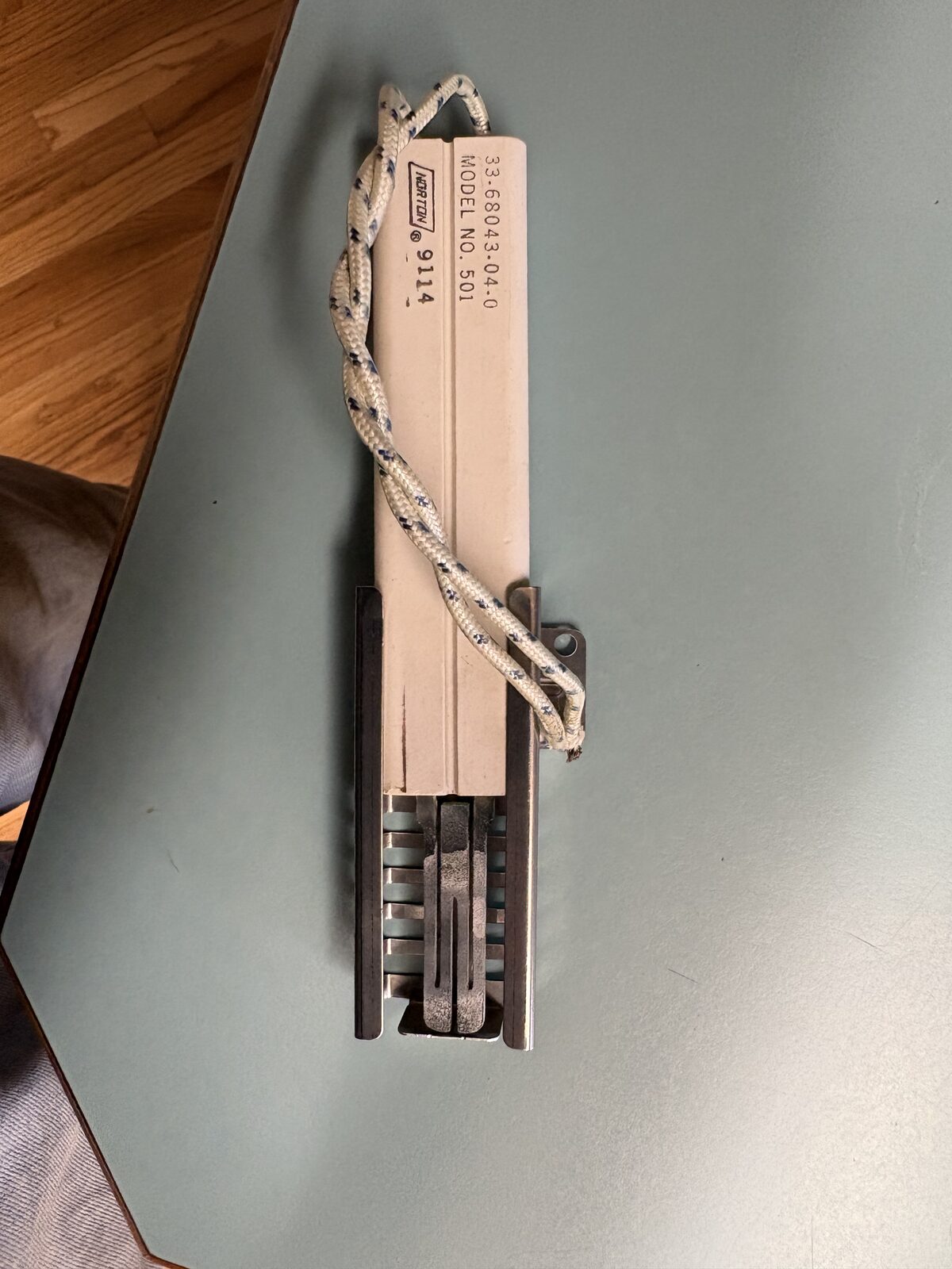 Worn gas oven ignitor with a chalky white glow bar documented during a Knapp's service call in the Portland area.